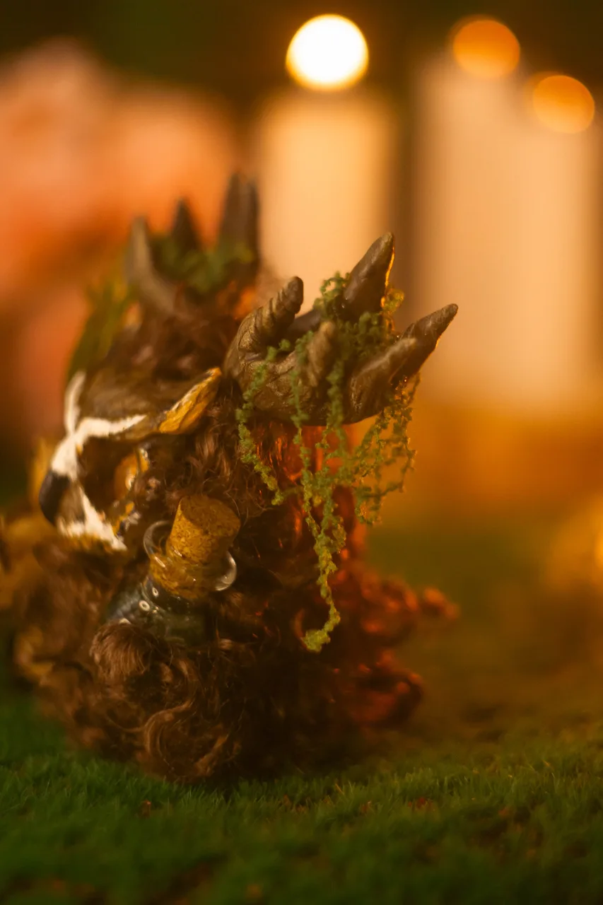 Blooming Forest fluffy — close-up of moss and forest details with owl holding potion vial