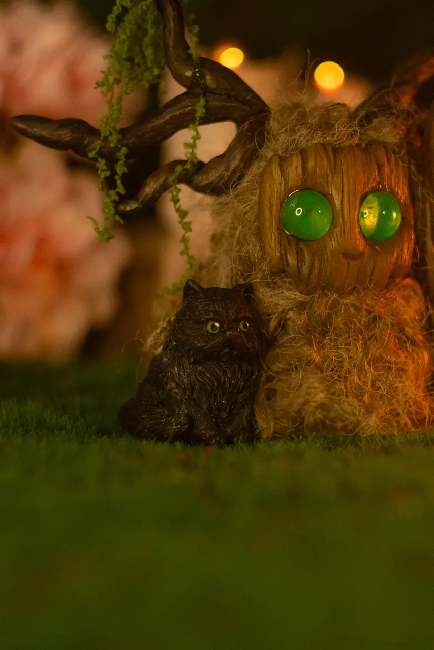 Forest Shaman fluffy — close-up of spring-green glowing eyes and antler branch crown