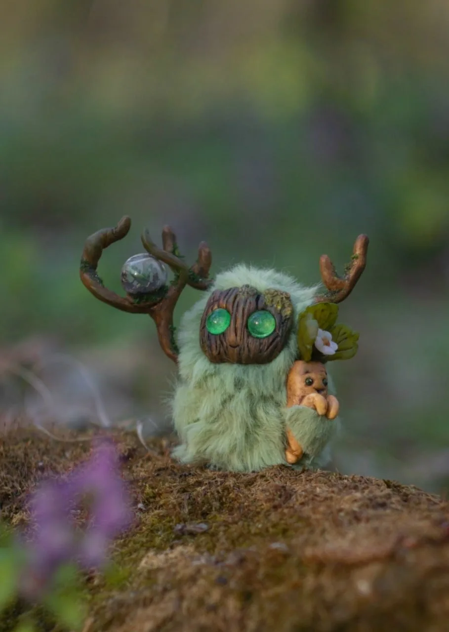 Greenhouse Keeper — handmade mint green wool Fluffy with glowing green eyes, glass orb staff with spring sprout and strawberry root in paw | Gnomenlands Wild Garden collection