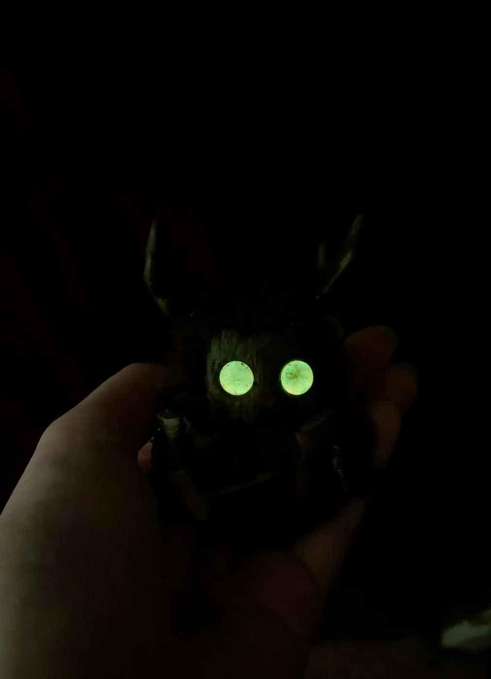 The Healer fluffy — amber eyes glowing in the dark