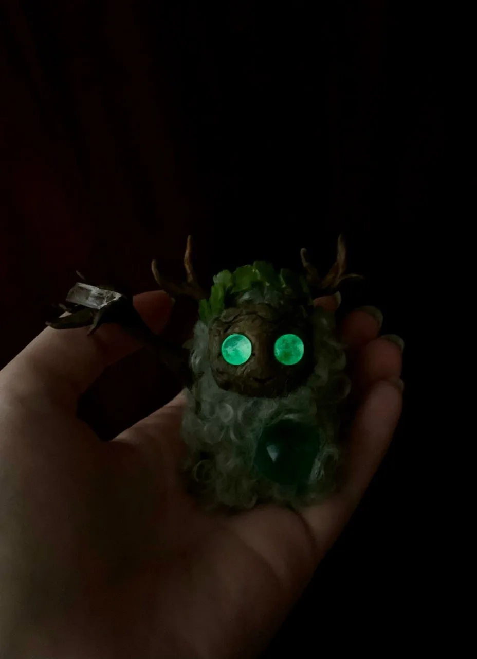 Misty Morning fluffy — vivid green eyes glowing in darkness