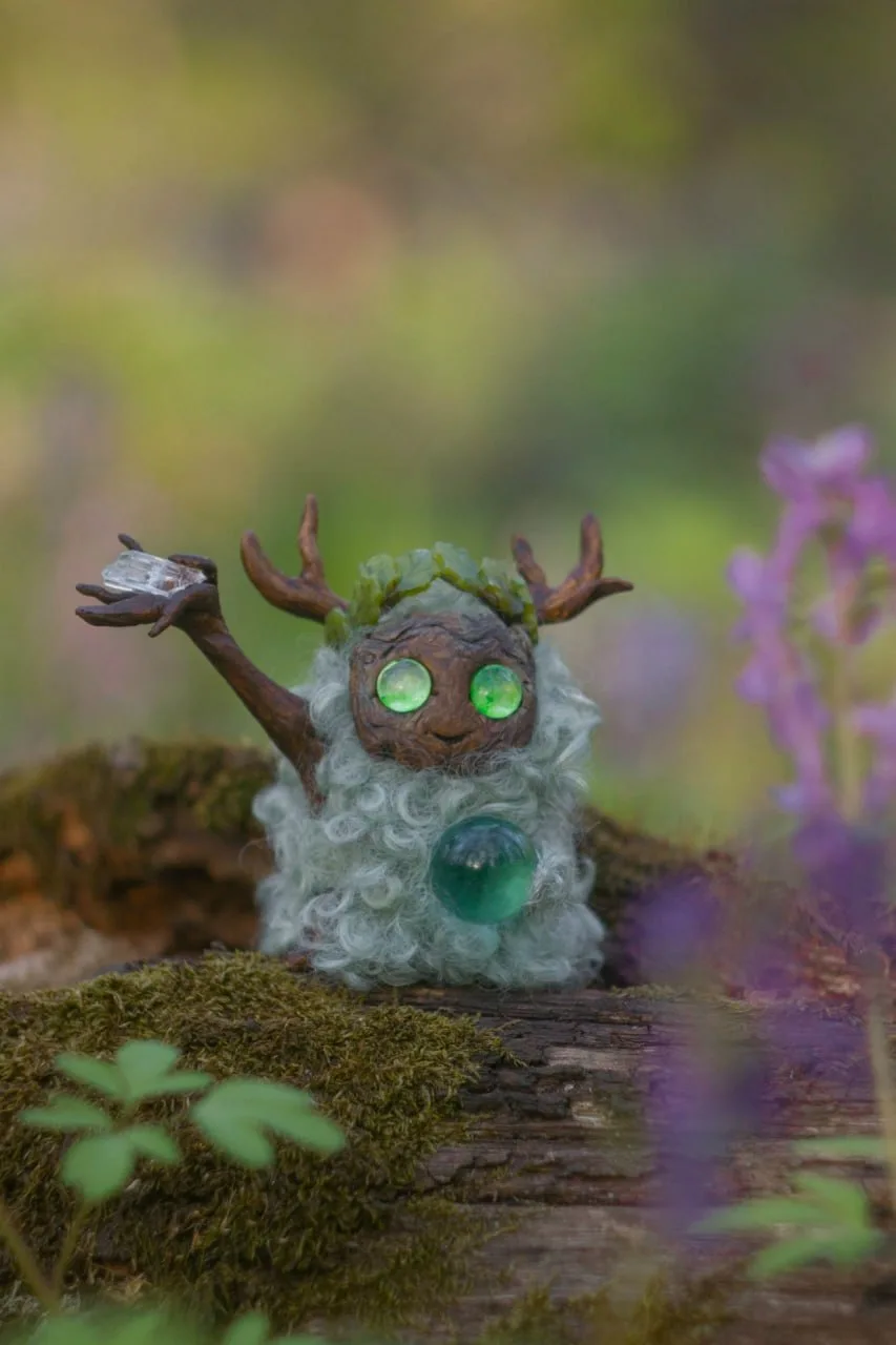 Misty Morning — handmade pale grey curly-wool Fluffy with glowing green eyes, dew crystals on staff and glass orb, on mossy forest ground | Gnomenlands Wild Garden collection