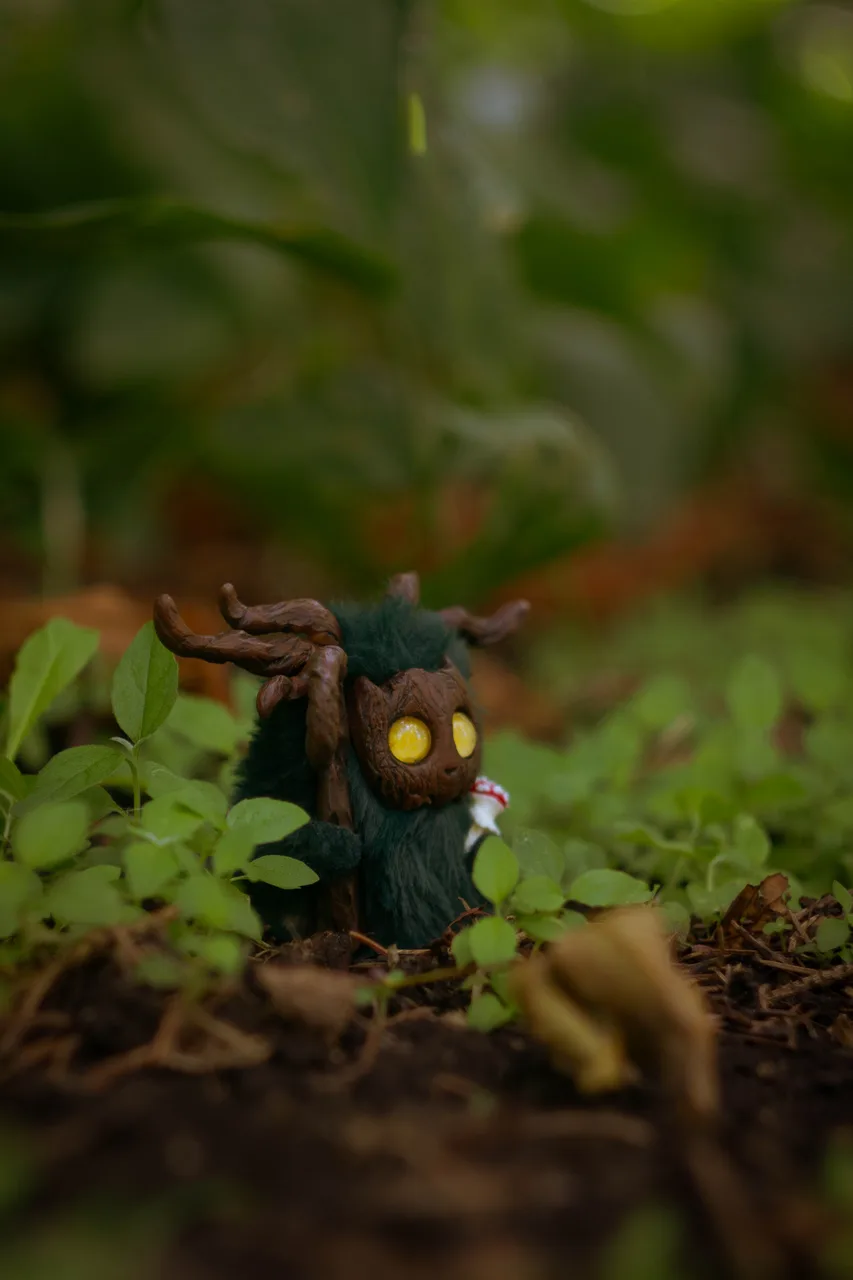 Mossy Flame fluffy — scene on mossy forest floor with fly agaric mushroom detail