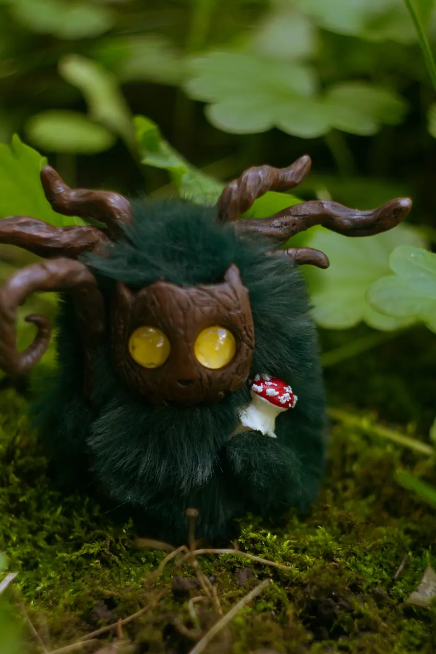 Mossy Flame fluffy — atmospheric forest scene with mushrooms and dappled light