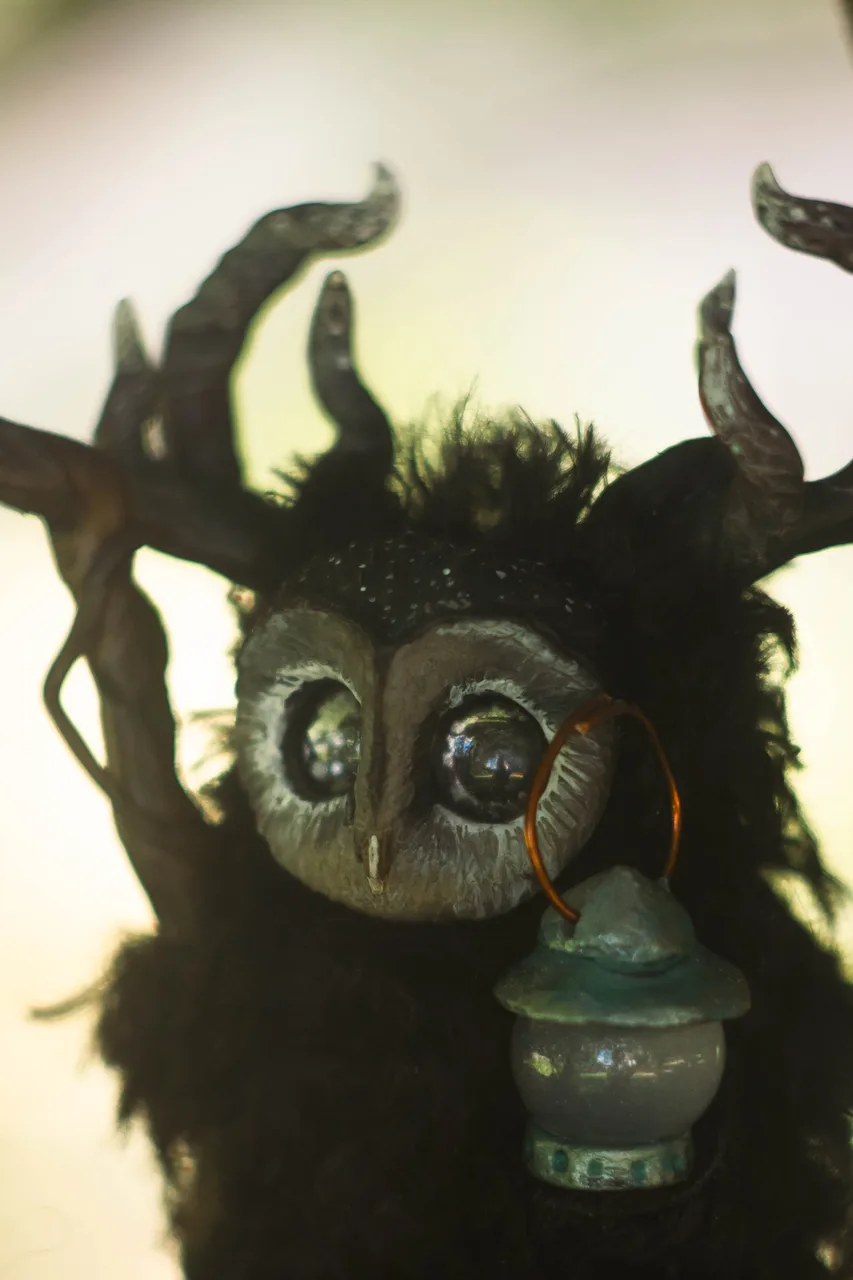 Night Wanderer fluffy — side view showing black wool texture and lantern detail