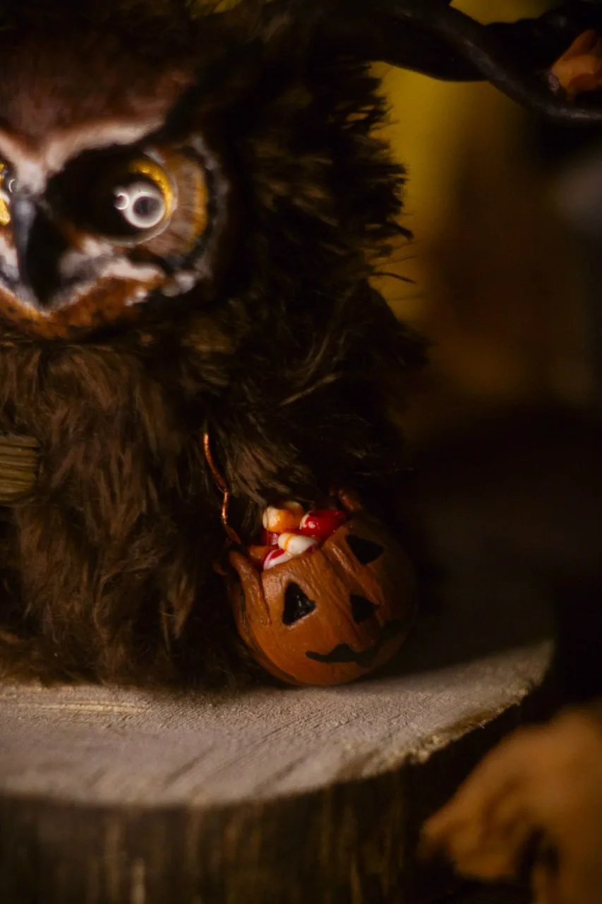 Rustle of Leaf Fall fluffy — close-up of miniature pumpkin cauldron filled with Halloween candy