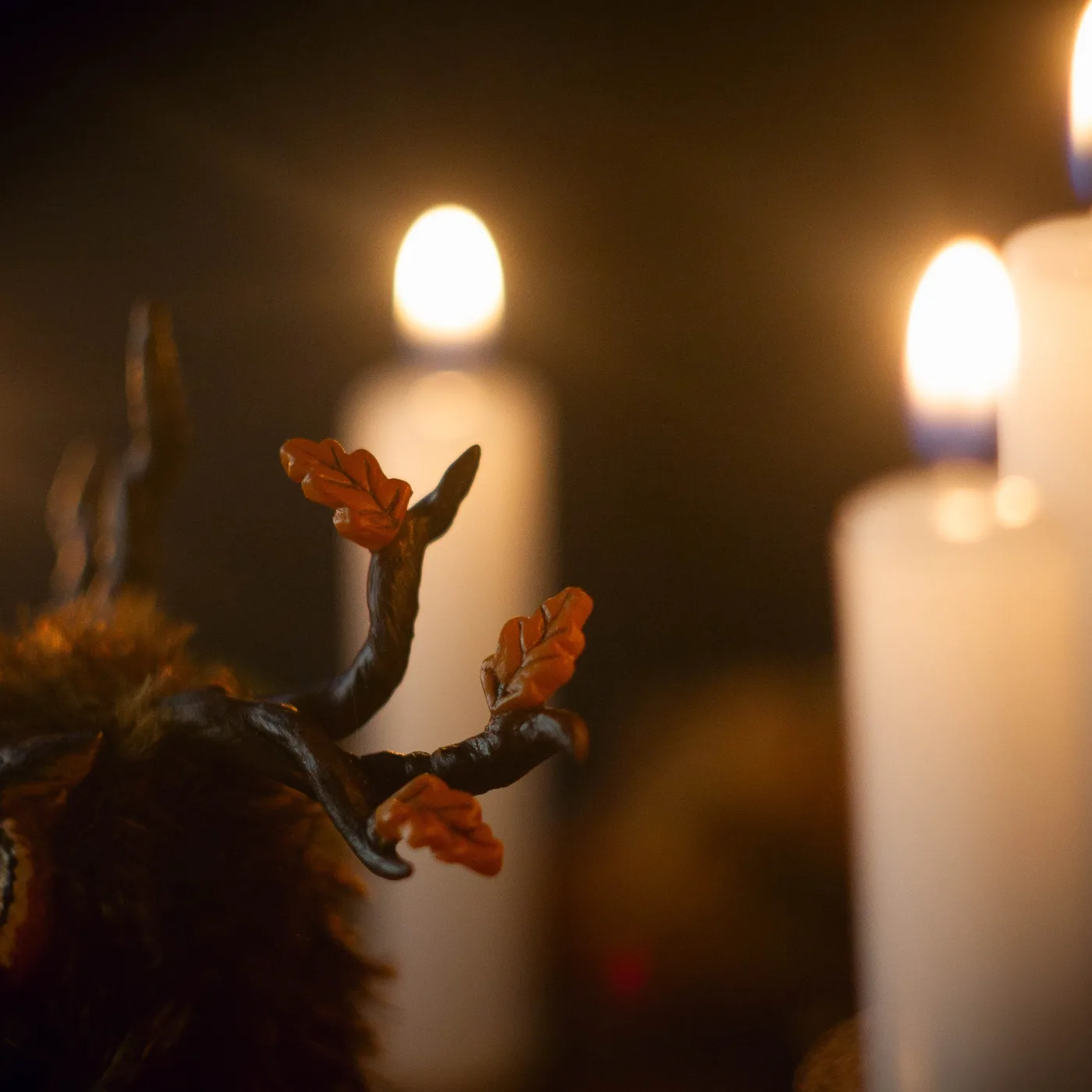 Rustle of Leaf Fall fluffy — close-up of autumn leaf antlers with orange oak leaves by candlelight