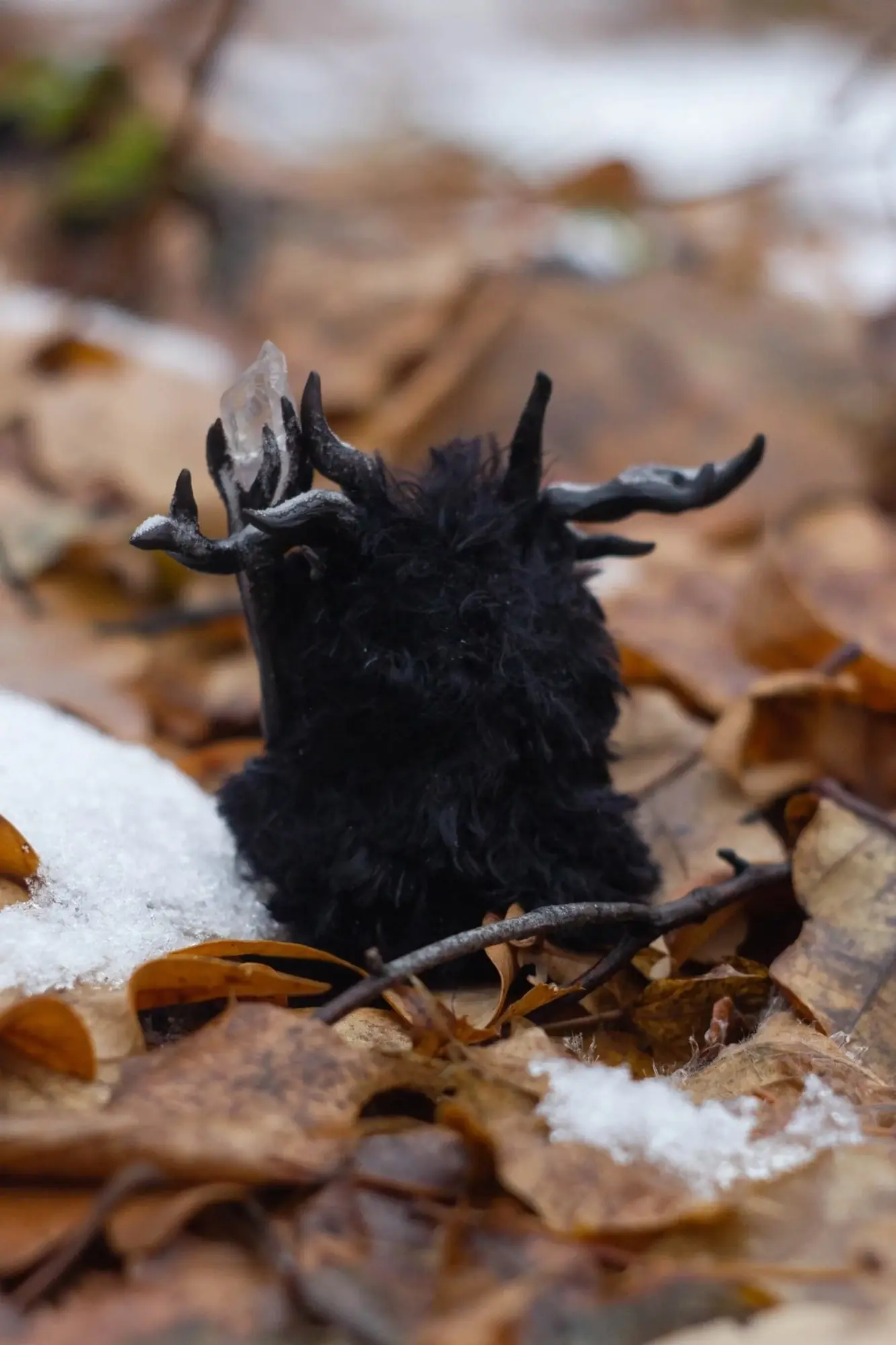 Sparkling Ice fluffy — back view showing black wool and branching dark antlers