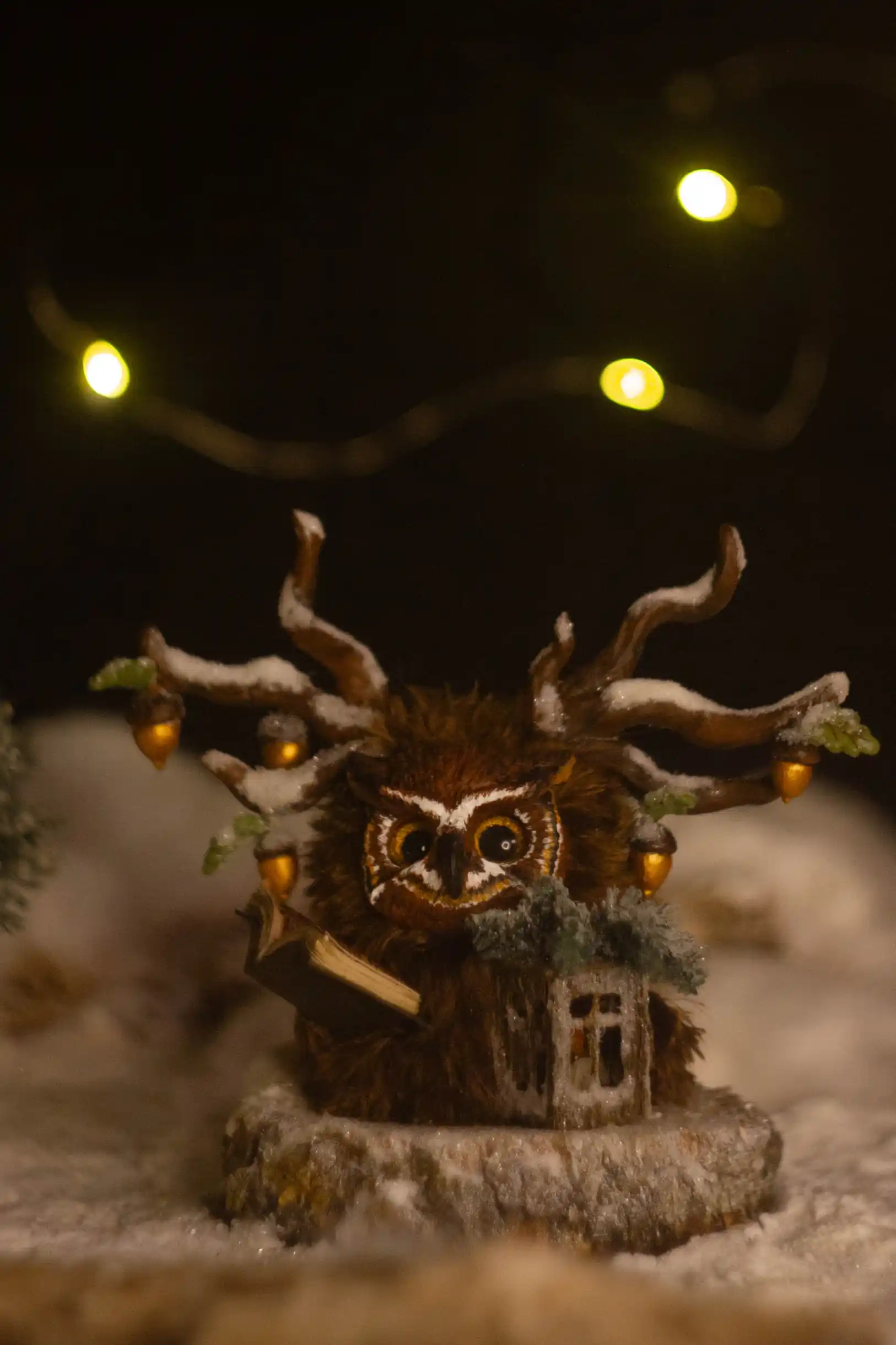 Hidden Knowledge -- handmade owl-like Fluffy reading in the treetops, antlers adorned with gilded acorns and evergreen oak leaves | Gnomenlands, Winter Glow collection