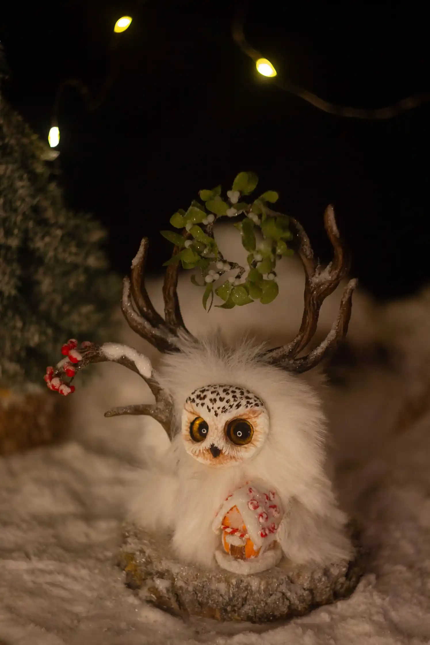 Sparkling Snow -- handmade pale Fluffy wearing a wreath of mistletoe with white berries, a gingerbread house nearby | Gnomenlands, Winter Glow collection