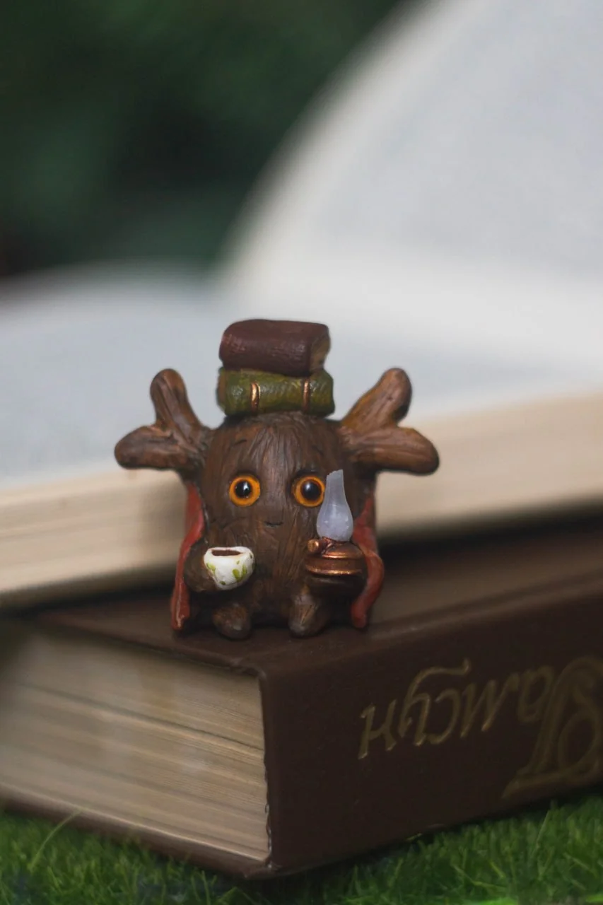 Forest Sprite Bookworm — handmade polymer clay figurine, books and kerosene lamp | Gnomenlands