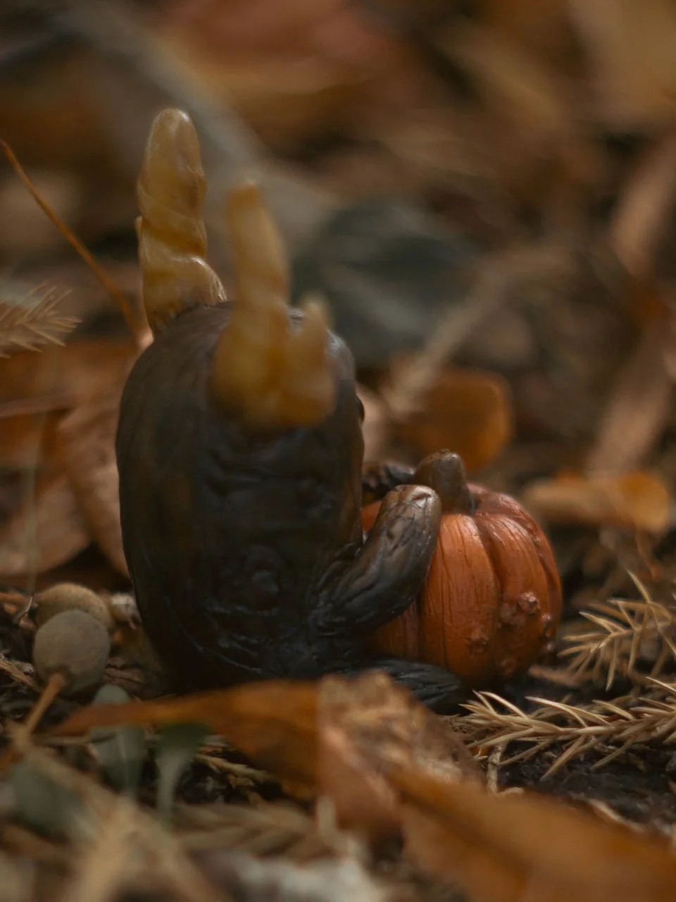 Forest Sprite Pumpkin Keeper — back view, dark bark-textured body with pumpkin beside
