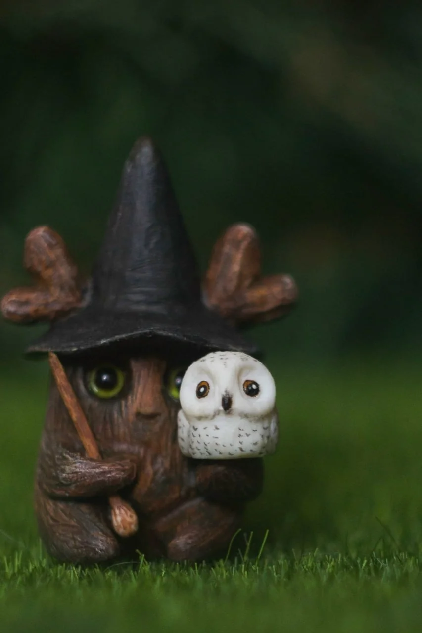 Forest Sprite Wizard — front closeup showing green iridescent eyes and snowy owl detail