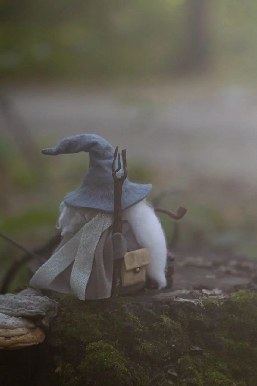 Handmade gnome in grey cloak — rear view