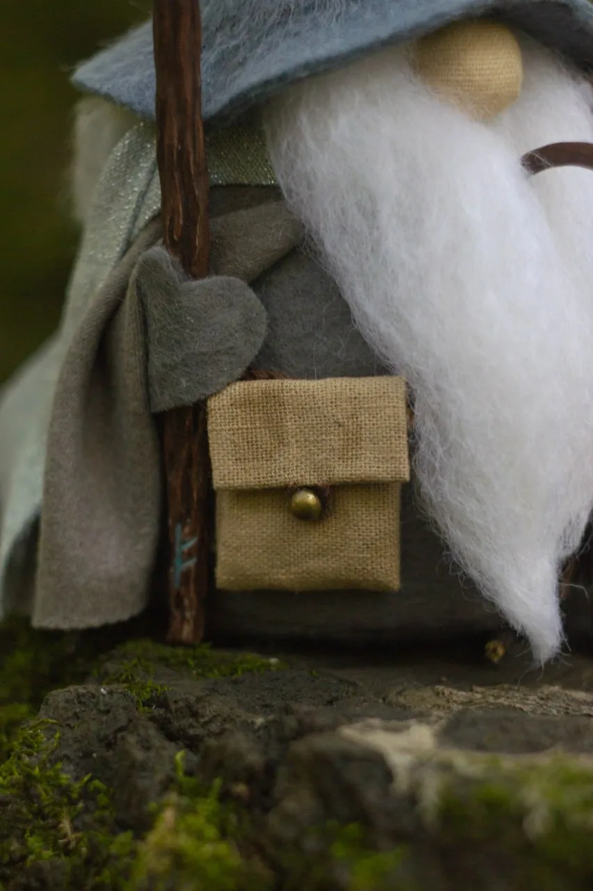 Collectible gnome — detail of linen bag with brass button