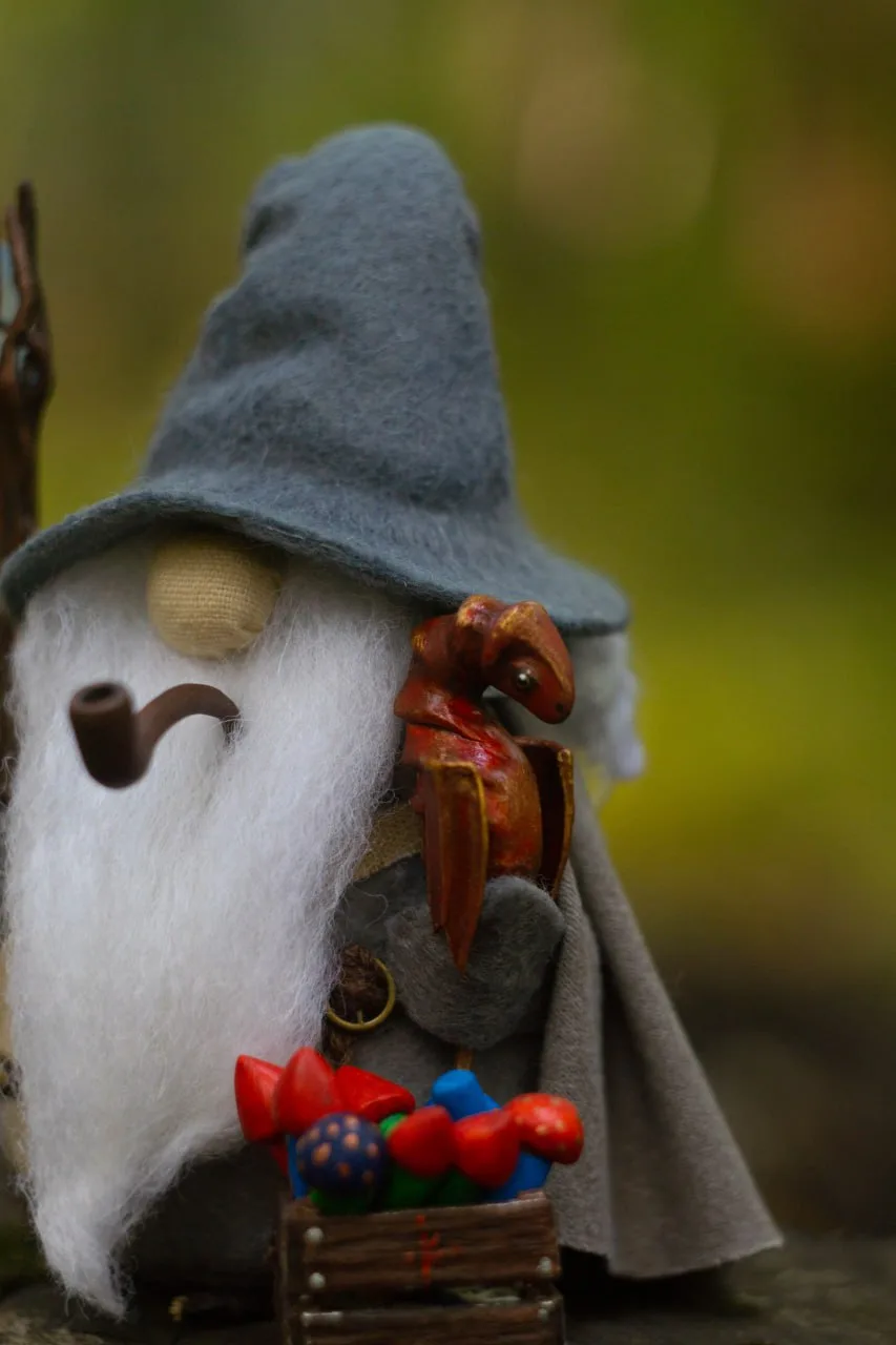 Wizard gnome with red polymer-clay dragon-rocket