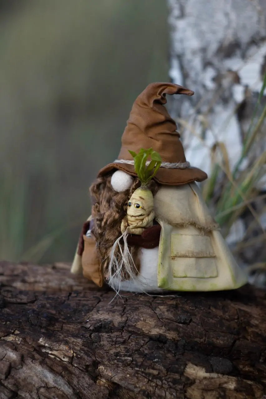 Collectible gnome interior figure in brown pointed hat