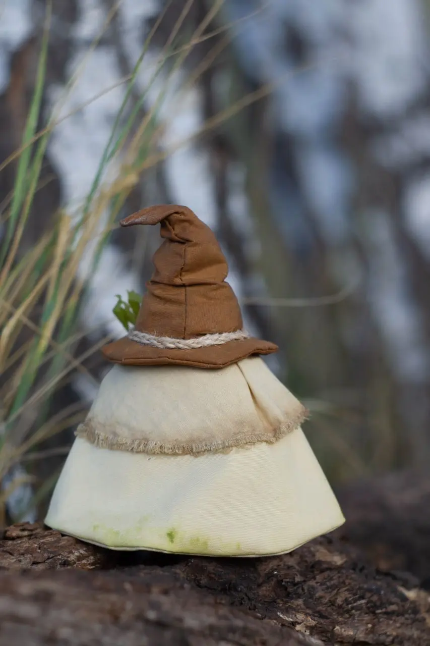 Miniature handmade Scandinavian gnome in beige cotton mantle