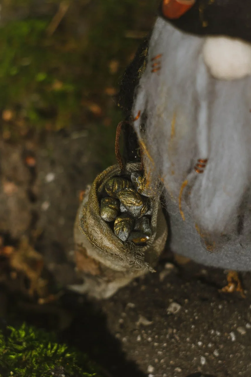 Gnome Gold Digger — polymer-clay sack of gold ore, side view