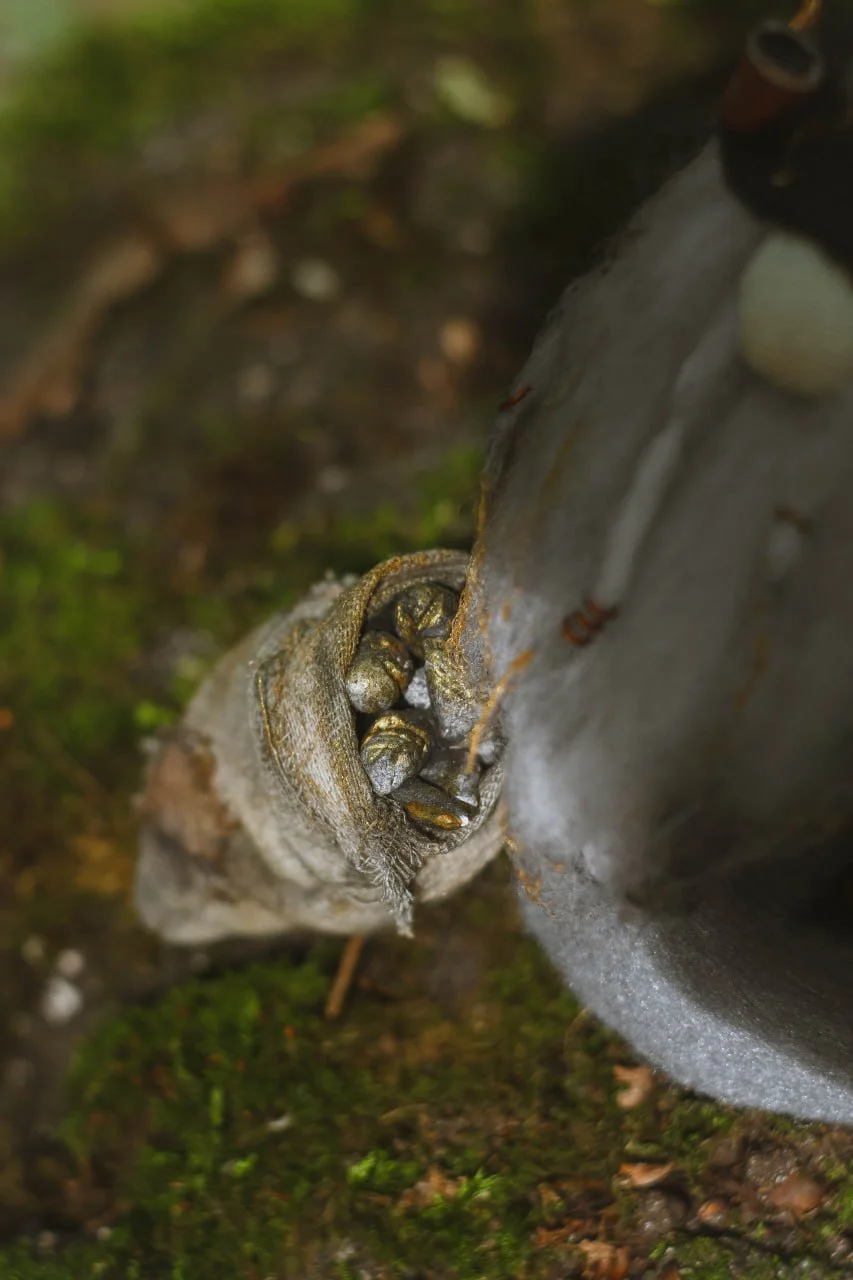 Gnome Gold Digger — polymer-clay sack with gold nuggets, top view