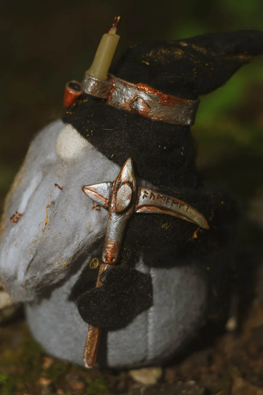 Gift Gnome Gold Digger — side view, silver rune-engraved pickaxe closeup