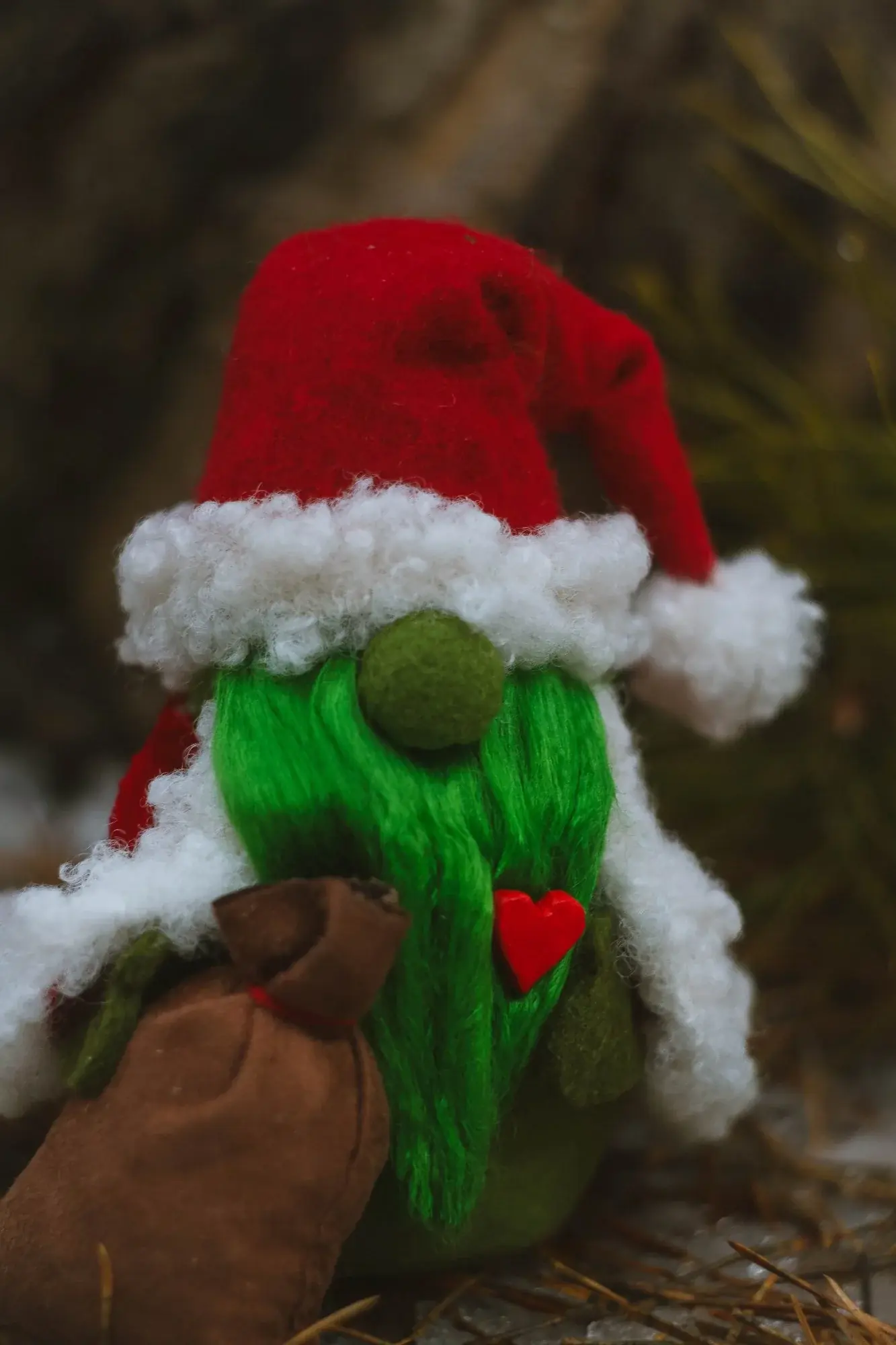 Gnome Grinch — closeup of green beard and red clay heart