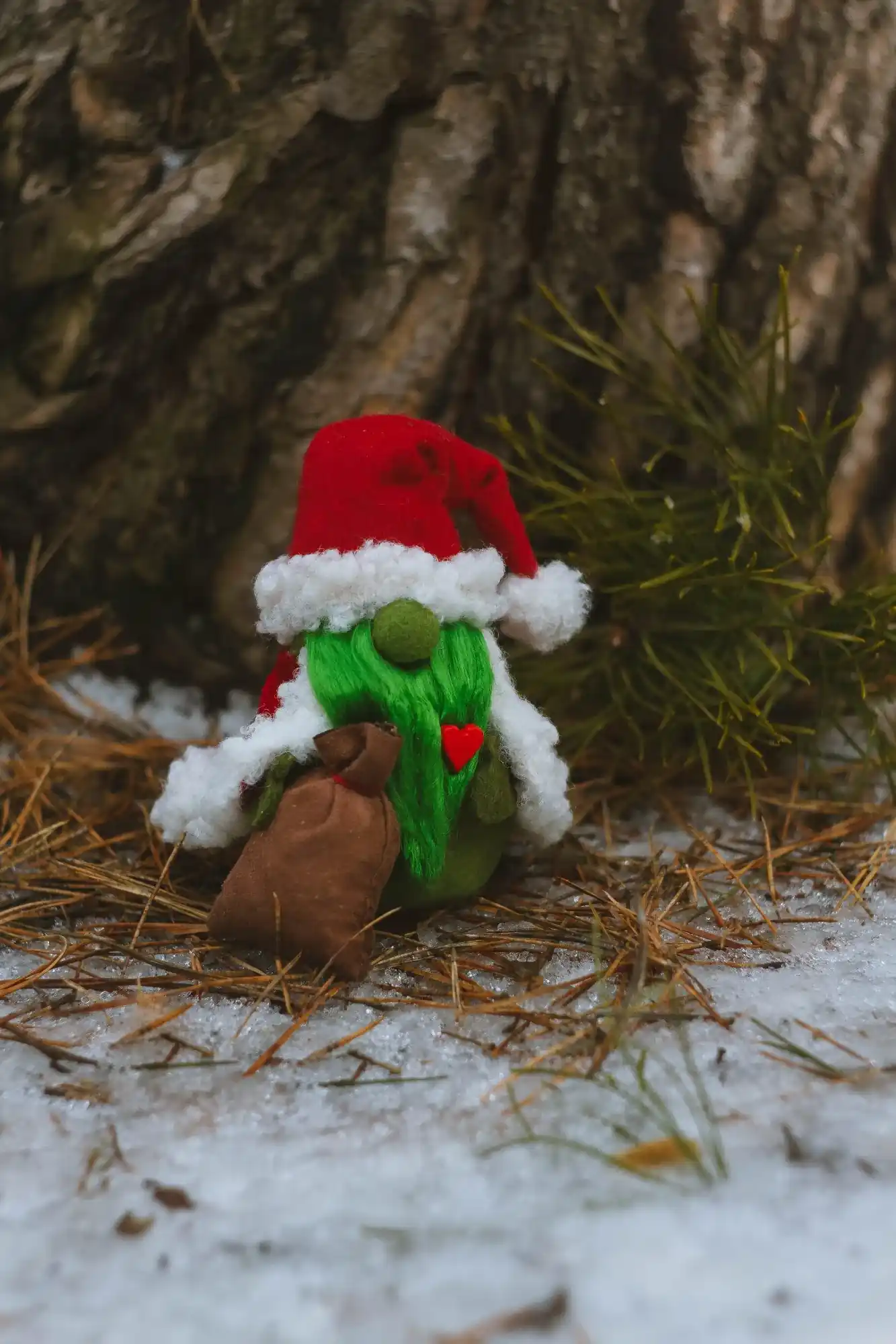 Collectible Gnome Grinch — full front view by snowy tree
