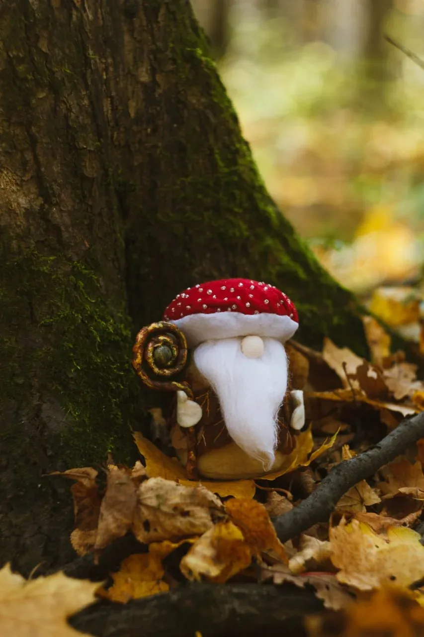 Collectible handmade gnome in mushroom hat with leaf vest