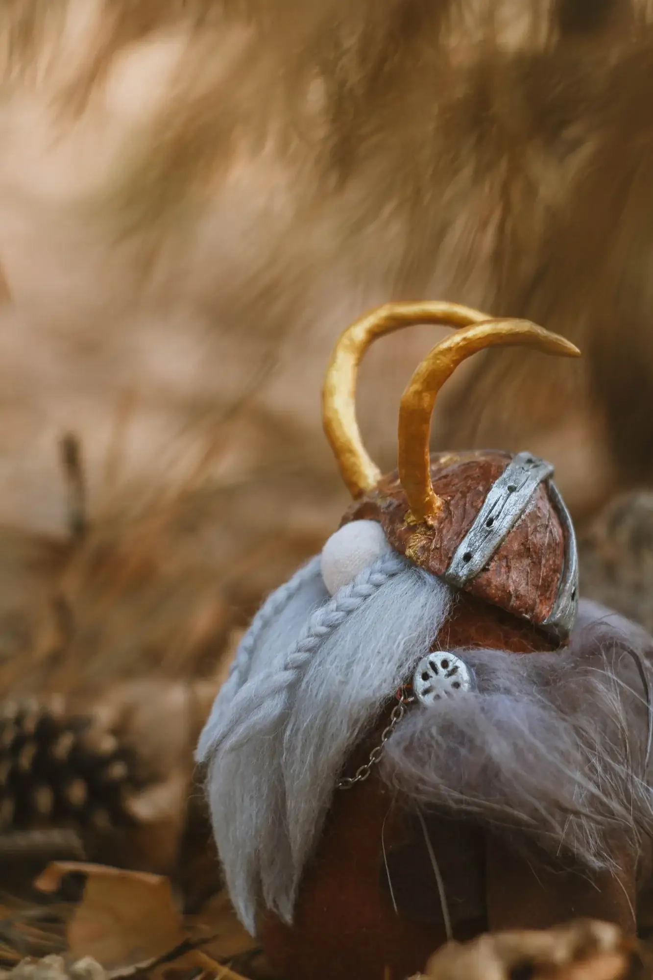 Gnome Konung's gold-horned helmet — side view closeup
