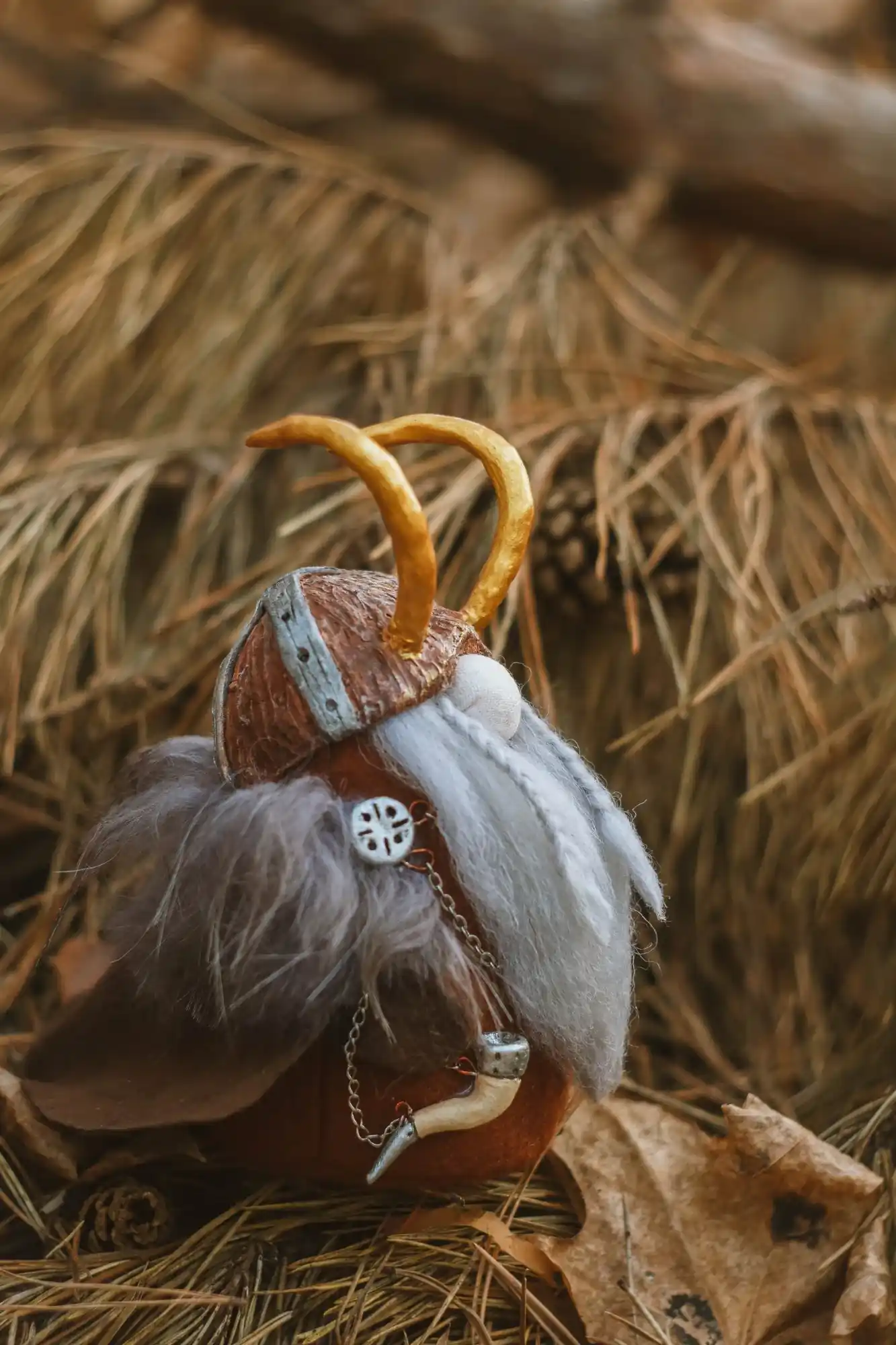 Gnome Konung — side view with drinking horn and fur cloak among pine needles