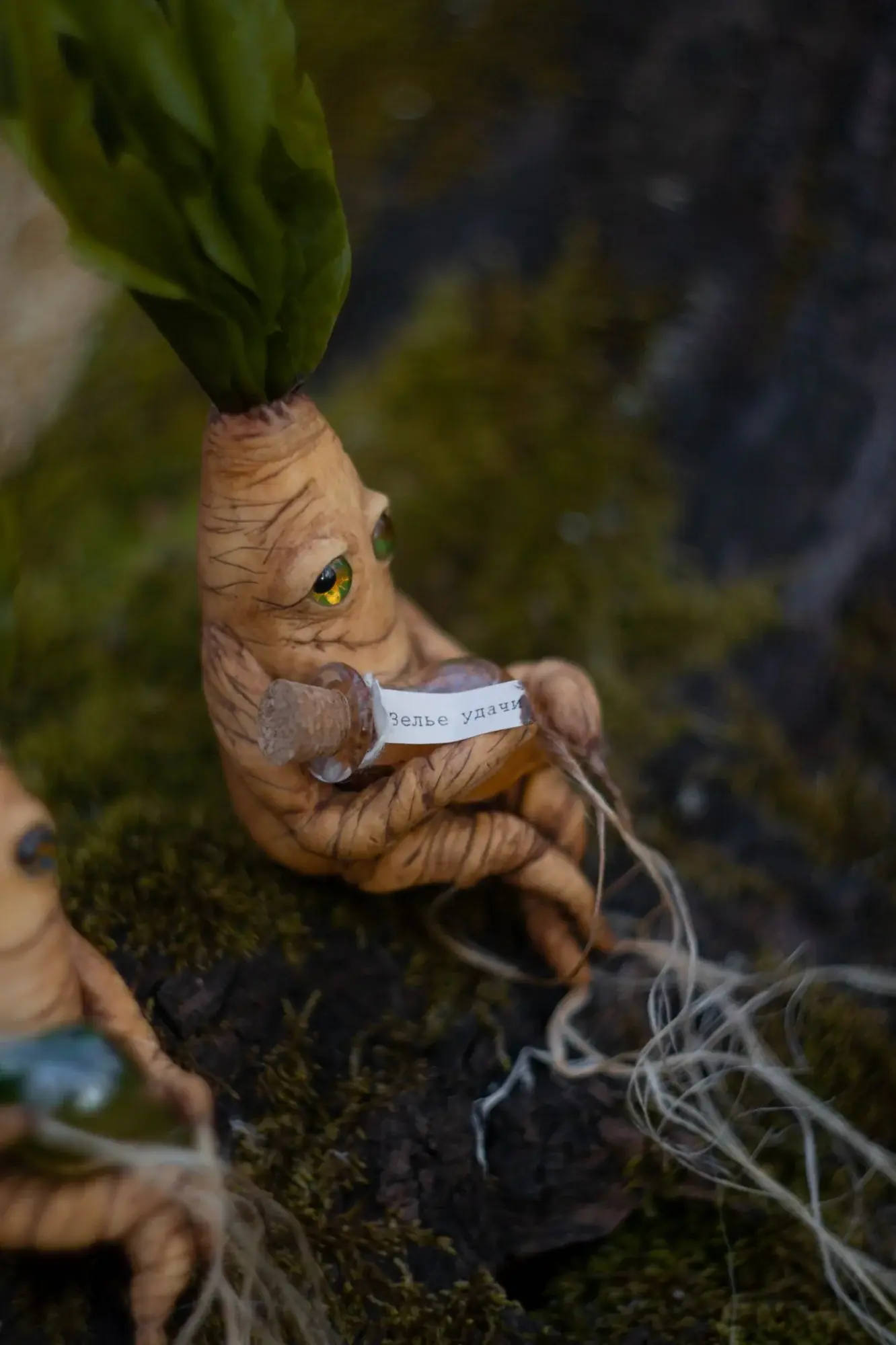 Mandrake root figurine holding a luck potion vial — handmade polymer clay magical creature