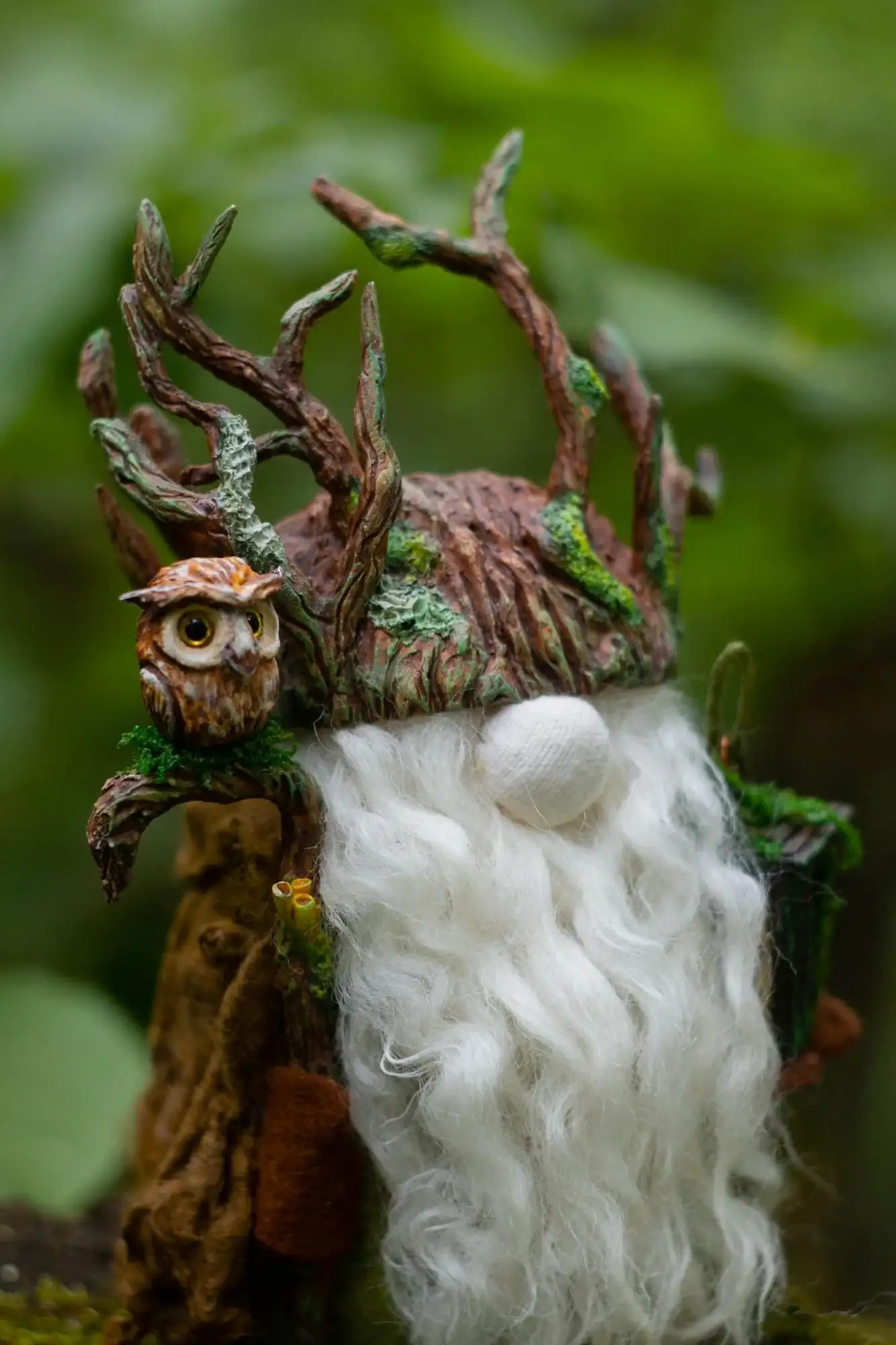 Gnome Night Warden — branch helmet with green moss and clay owl on green background