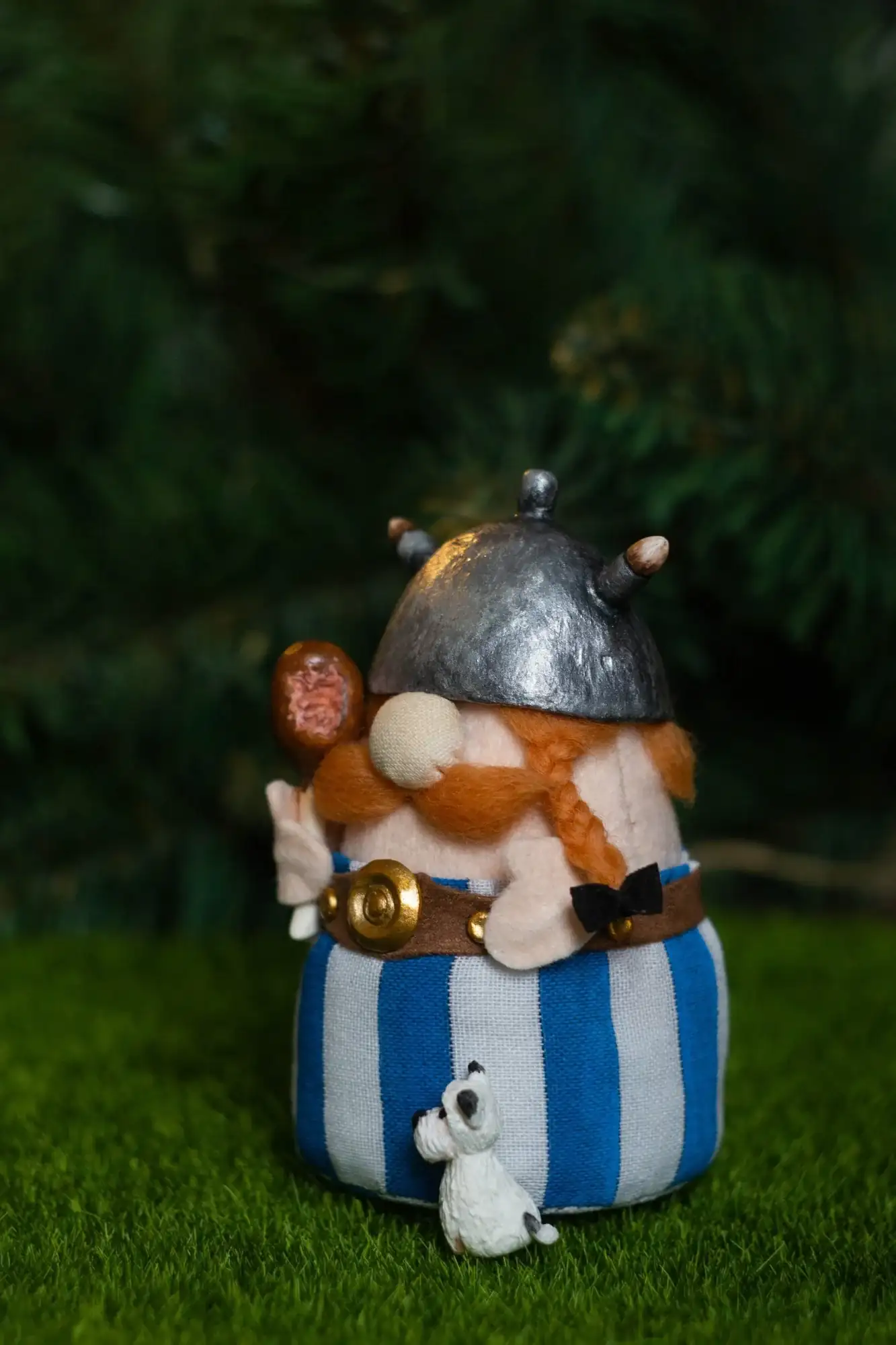Gnome Obelix — ginger braids with bow, spiked clay helmet, Dogmatix on grass