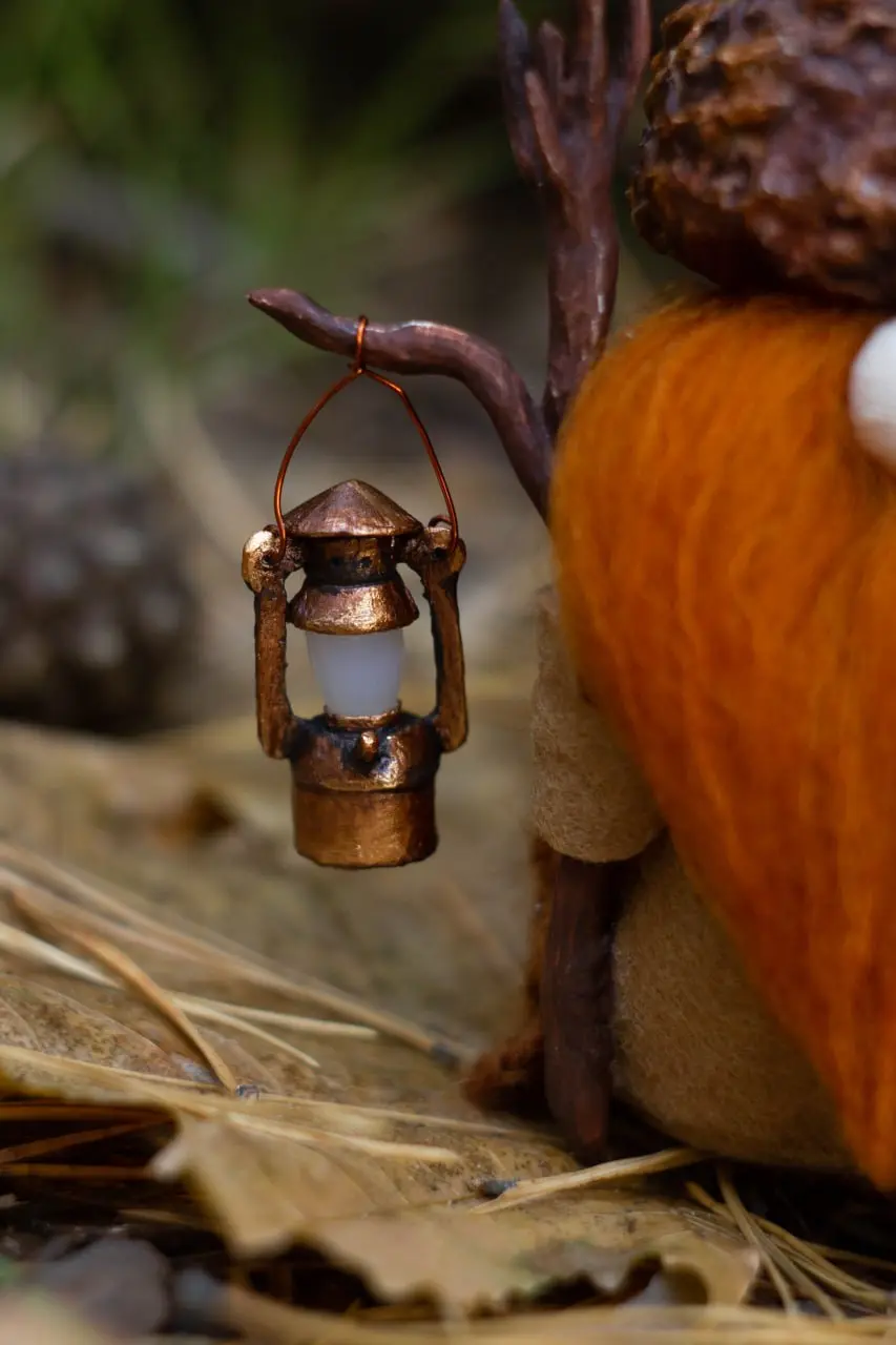 Forest gnome with kerosene lantern — interior decor