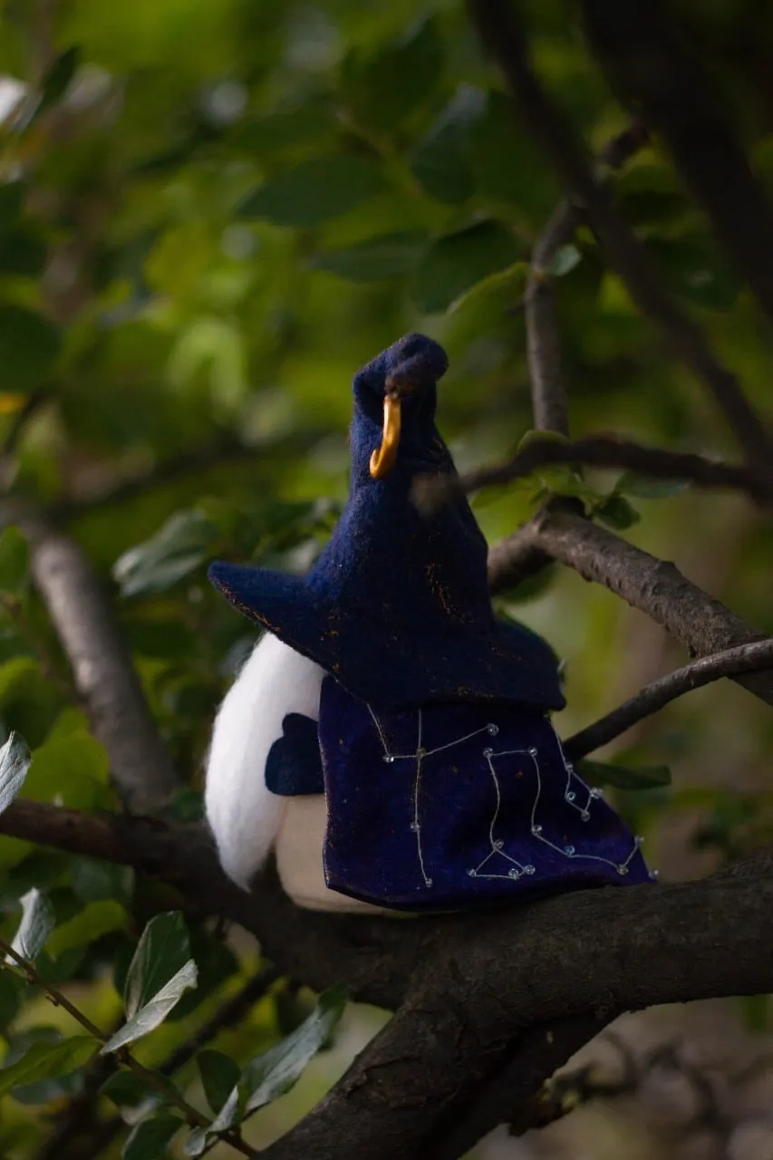 Decorative fantasy gnome in blue hat and magical robes