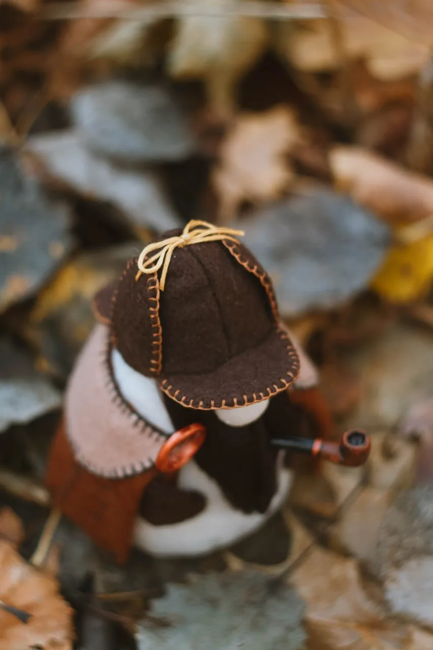 Gnome Sherlock's smoking pipe and magnifying glass — handmade closeup