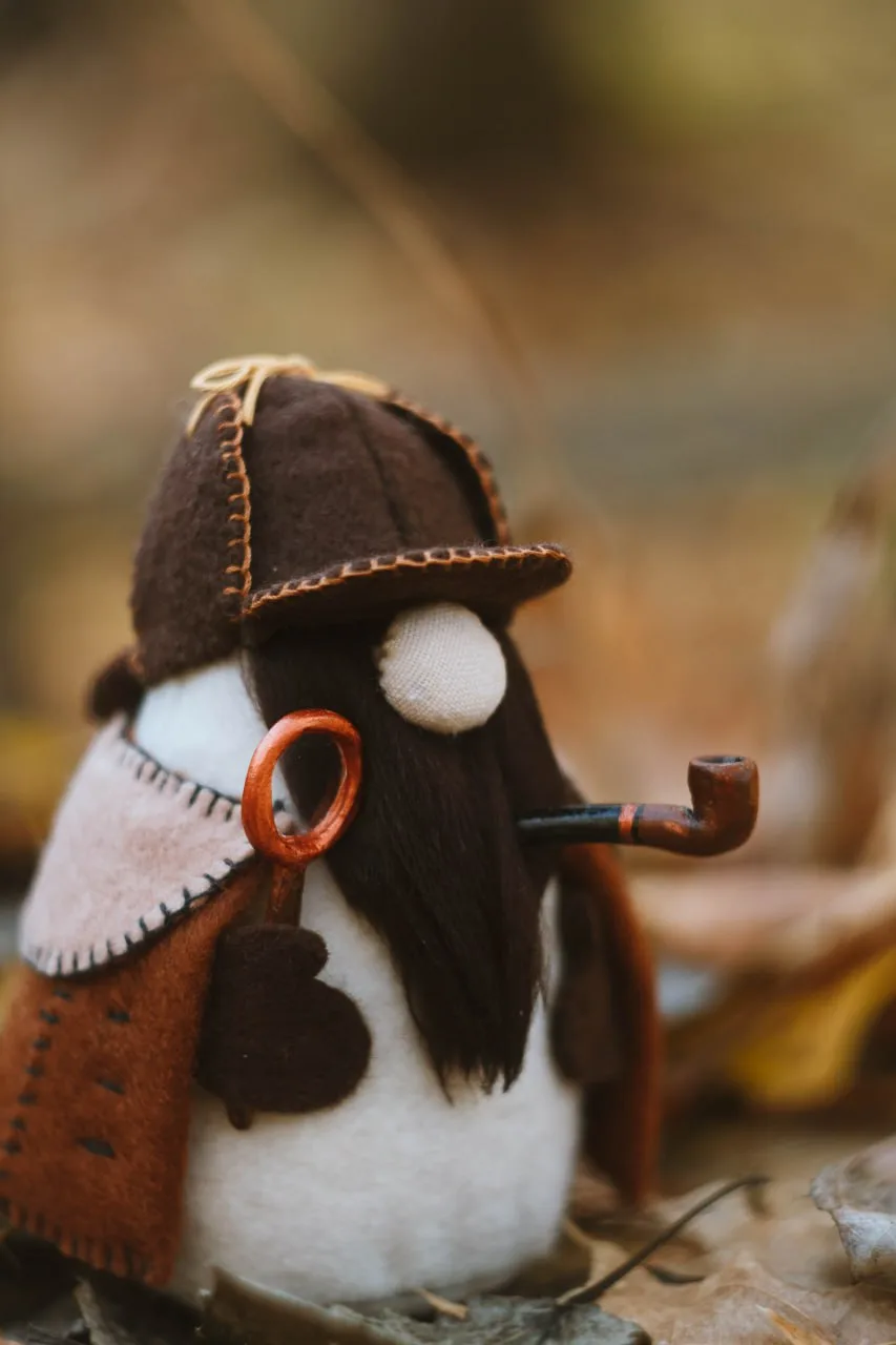 Gnome Sherlock's coat with copper buttons — rear view in autumn forest