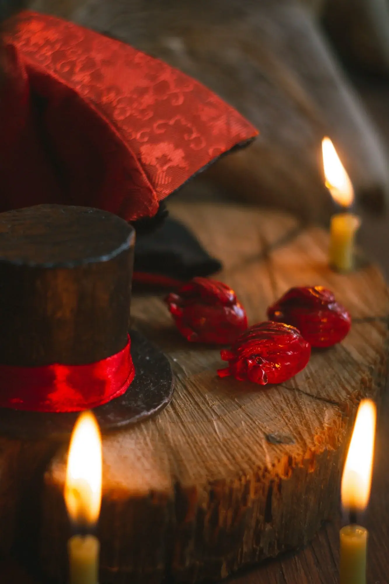 Gnome Vampire — red jacquard cloak texture, clay heart and satin-ribbon hat — closeup