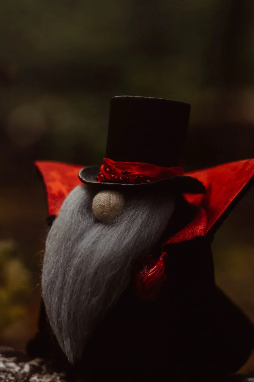 Samhain Gnome Vampire — grey wool beard, red jacquard cloak and clay heart — closeup