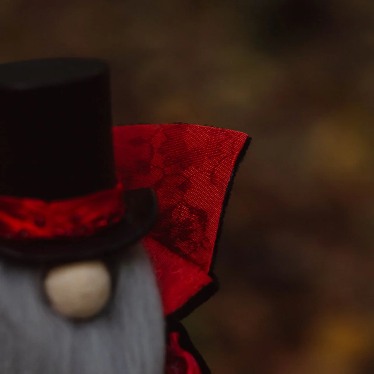 Gnome Vampire — red jacquard cloak with black trim — closeup