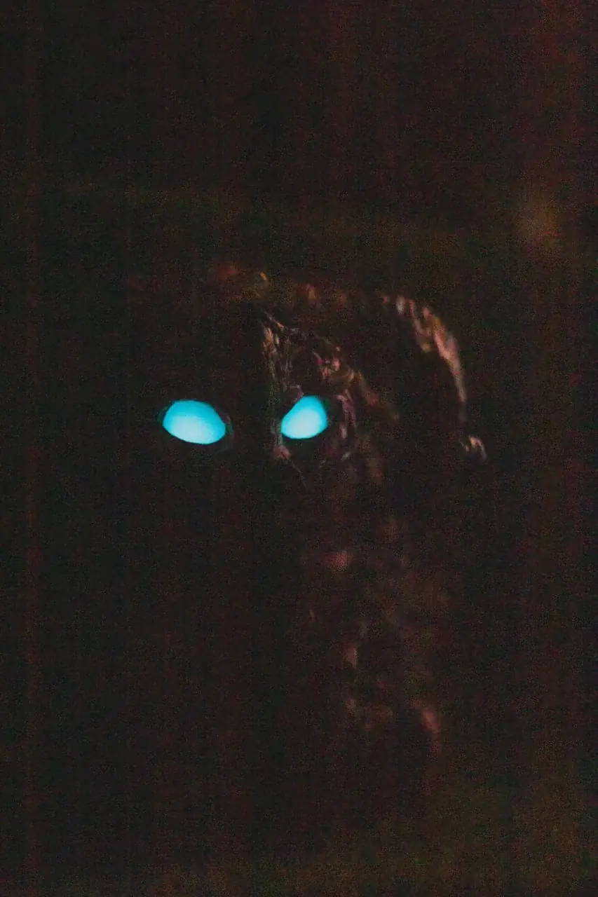 Wood Spirit Faun in the dark — intensely glowing blue eyes reflecting the light of the first moon, handmade collectible figurine inspired by Guillermo del Toro's Pan's Labyrinth