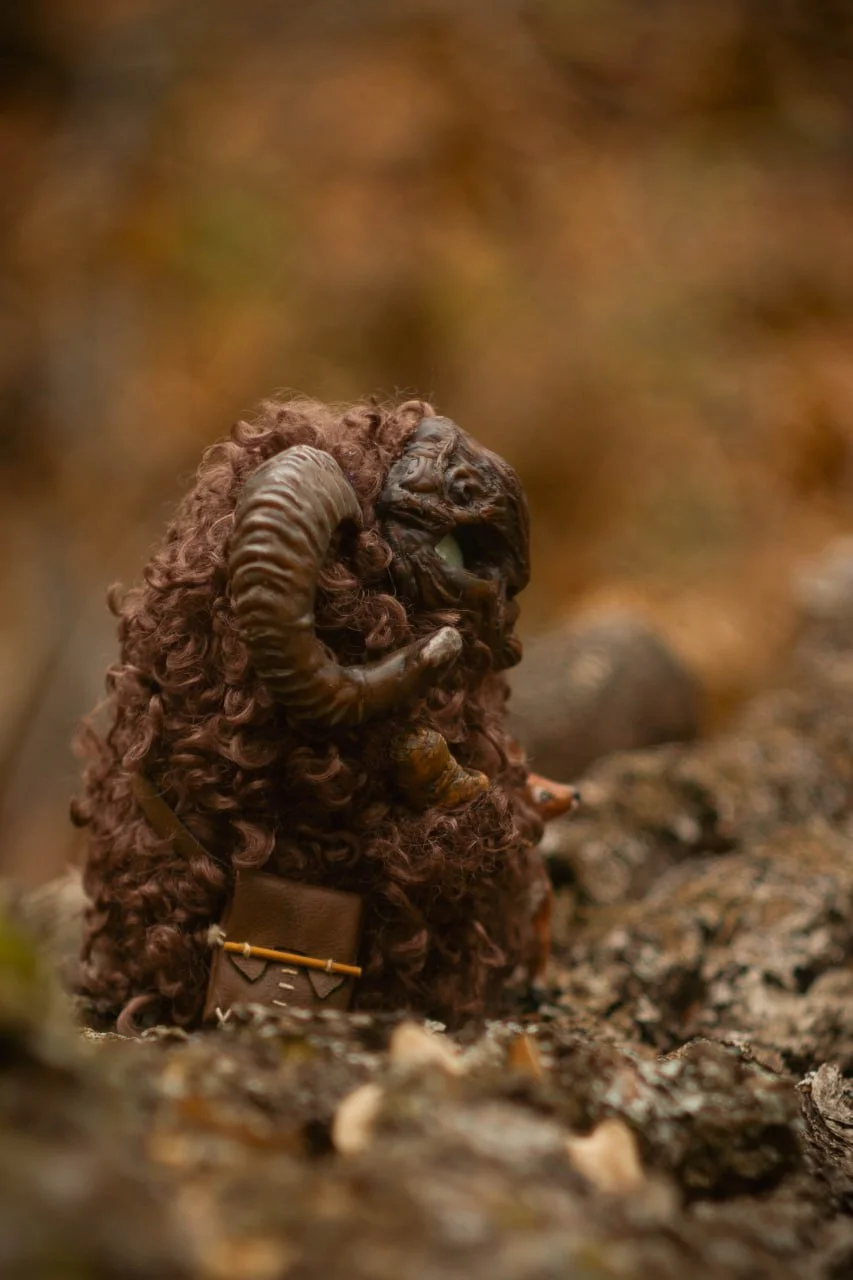 Mandrake root in Wood Spirit Faun's hands — handmade polymer clay sculpture, symbol of healing and protection, artisan miniature from Pan's Labyrinth inspired collectible figurine