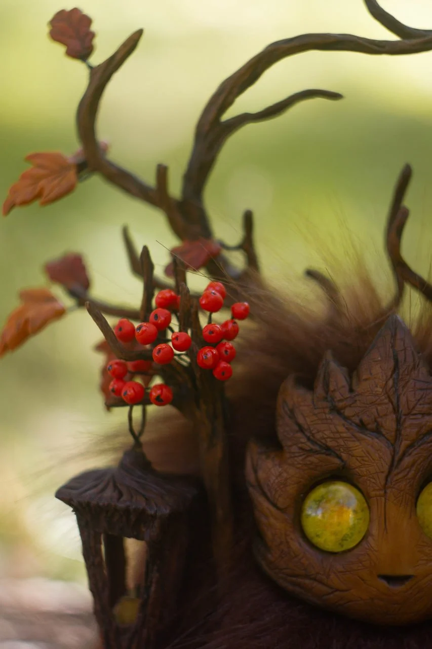 Wood Spirit Mabon Rustle antlers close-up — clusters of scarlet rowan berries and burgundy oak leaves, detailed handmade polymer clay artisan collectible