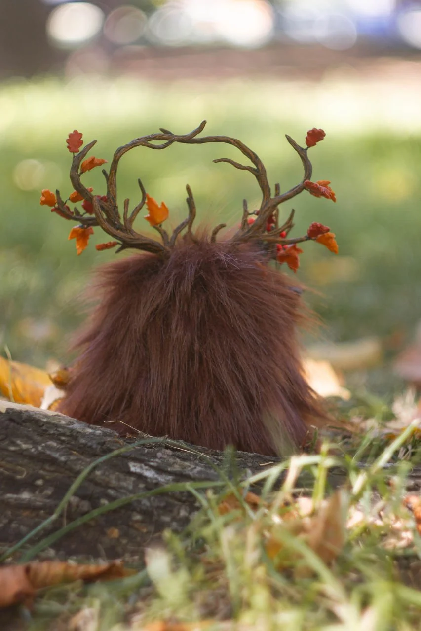 Harvest basket of Wood Spirit Mabon Rustle close-up — handmade polymer clay pumpkins, apples and corn in a willow-woven basket, artisan Samhain and Mabon home décor