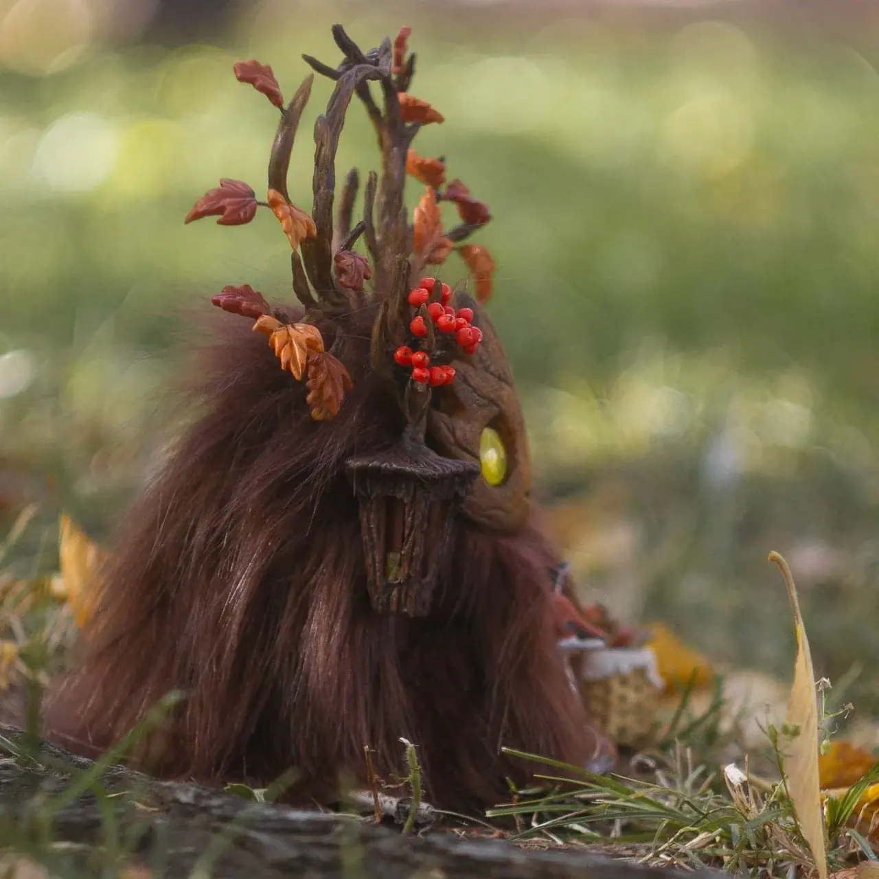 Wood Spirit Mabon Rustle — side view with harvest basket and fox, dark burgundy faux fur and branching antlers with rowan berries, handmade woodland creature sculpture