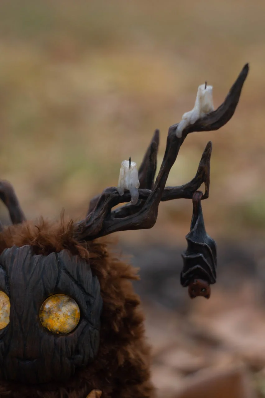 Wood Spirit Samhain Whisper antlers close-up — detailed handmade polymer clay autumn leaves, berries and tiny bat figurines, artisan collectible detail