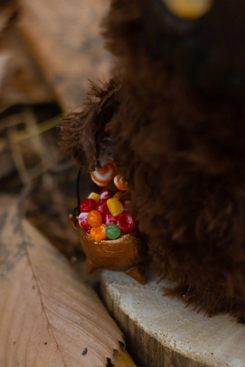 Wood Spirit Samhain Whisper in a dark autumn forest — handmade collectible gothic forest guardian figurine among trees and fallen leaves